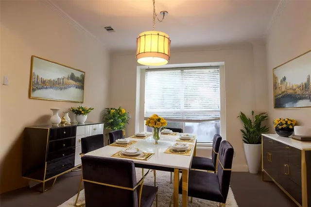 a view of a dining room with furniture and window