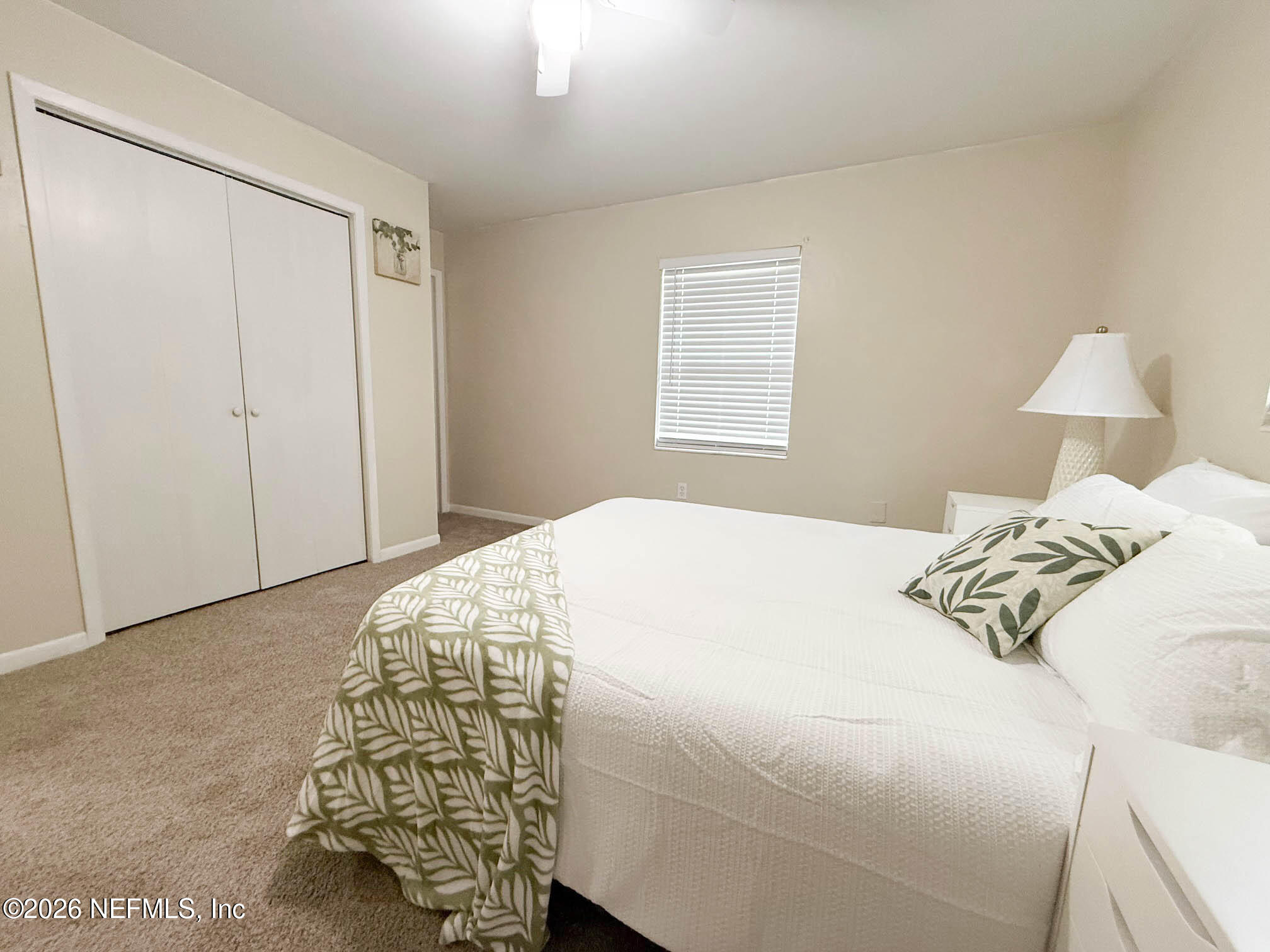 22620 Southeast Hawthorne Road Hawthorne, FL 32640 - Photo 17 of 28 a bedroom with a bed and a window