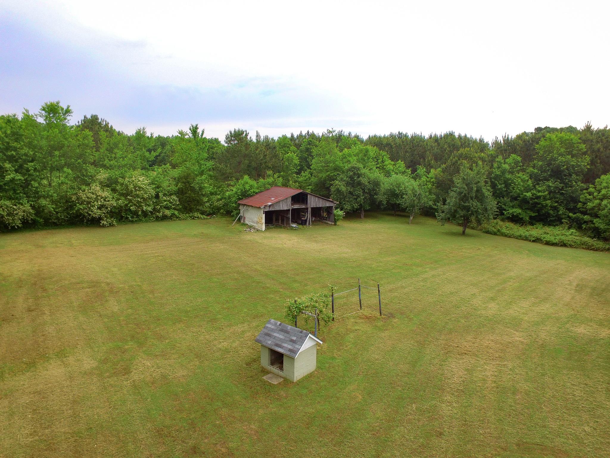 3955 Asbury Road Manchester, TN 37355 - Photo 19 of 19 a view of a lake with a house in the background