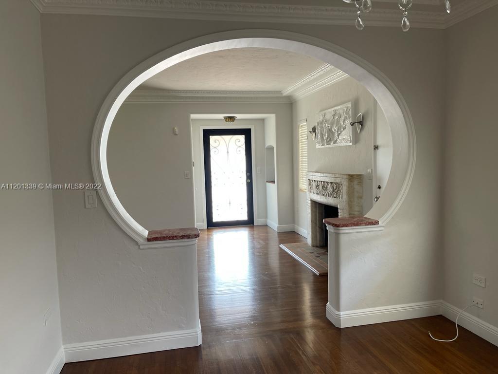 501 Southwest 24th Road Miami, FL 33129 - Photo 11 of 25 wooden floor in a hallway with a window