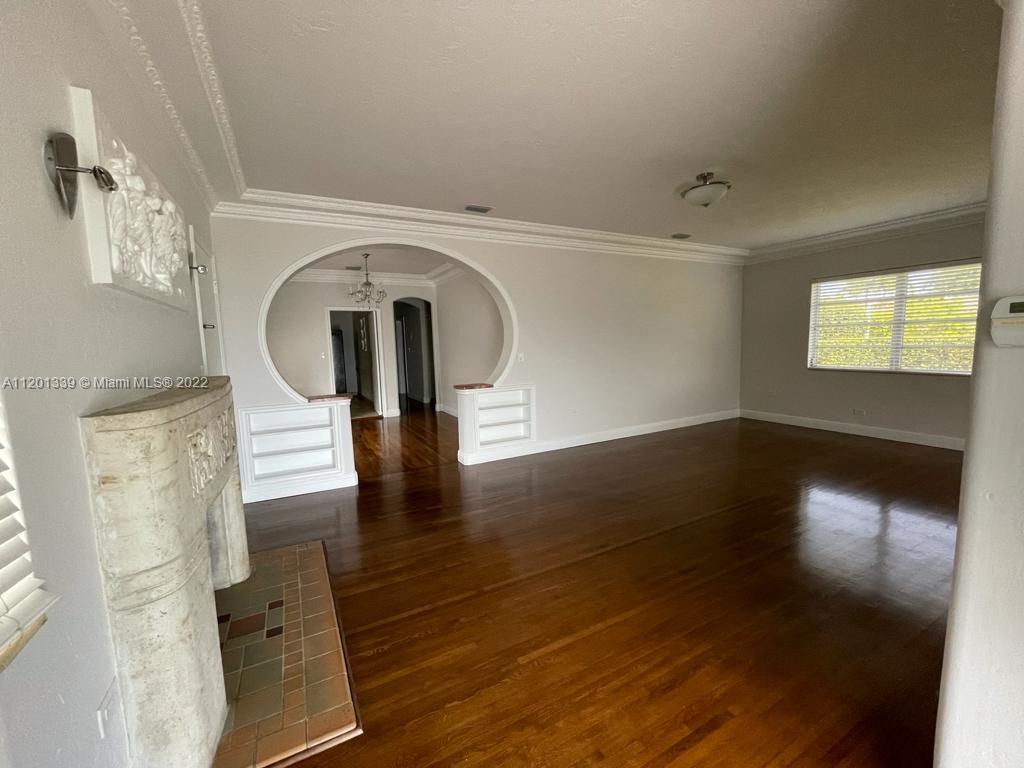 501 Southwest 24th Road Miami, FL 33129 - Photo 12 of 25 wooden floor in an empty room with a window