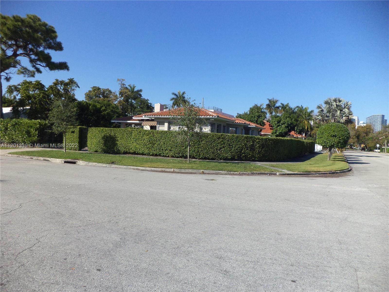 501 Southwest 24th Road Miami, FL 33129 - Photo 3 of 25 a front view of a house with a yard and garage