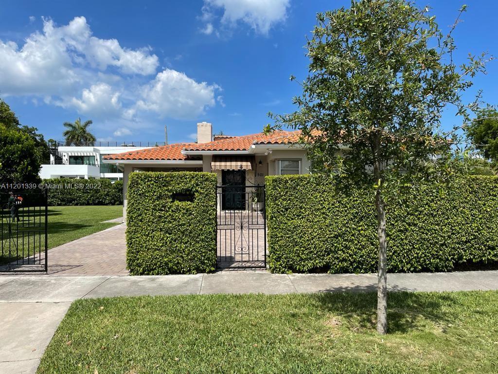 501 Southwest 24th Road Miami, FL 33129 - Photo 4 of 25 a front view of a house with a garden