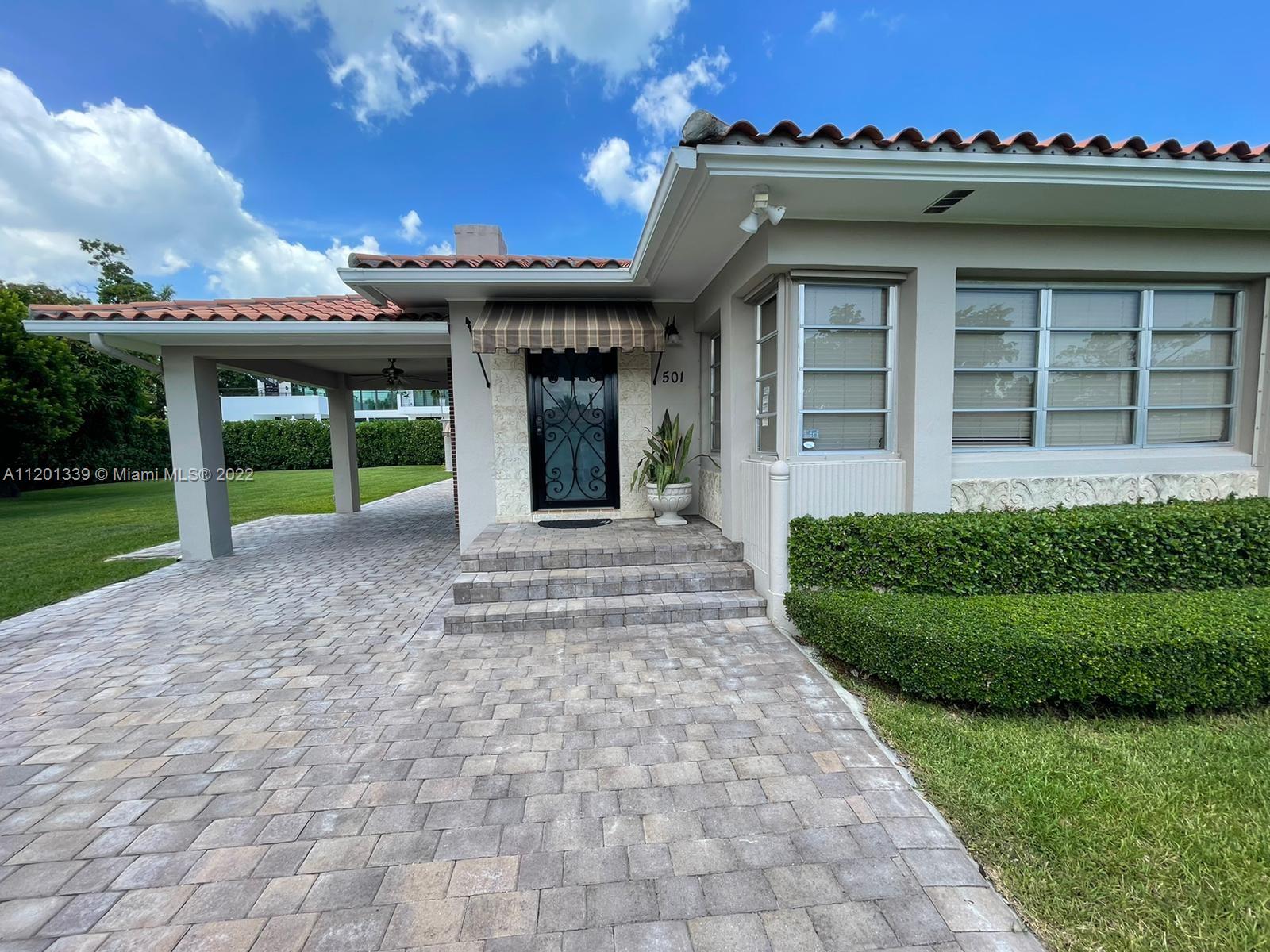 501 Southwest 24th Road Miami, FL 33129 - Photo 5 of 25 a view of a house with a yard and potted plants