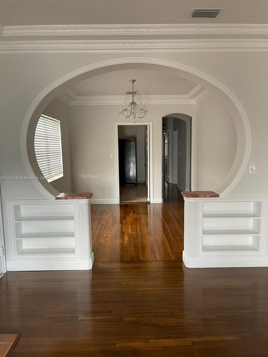 501 Southwest 24th Road Miami, FL 33129 - Photo 7 of 25 a view of a hallway view with wooden floor and staircase