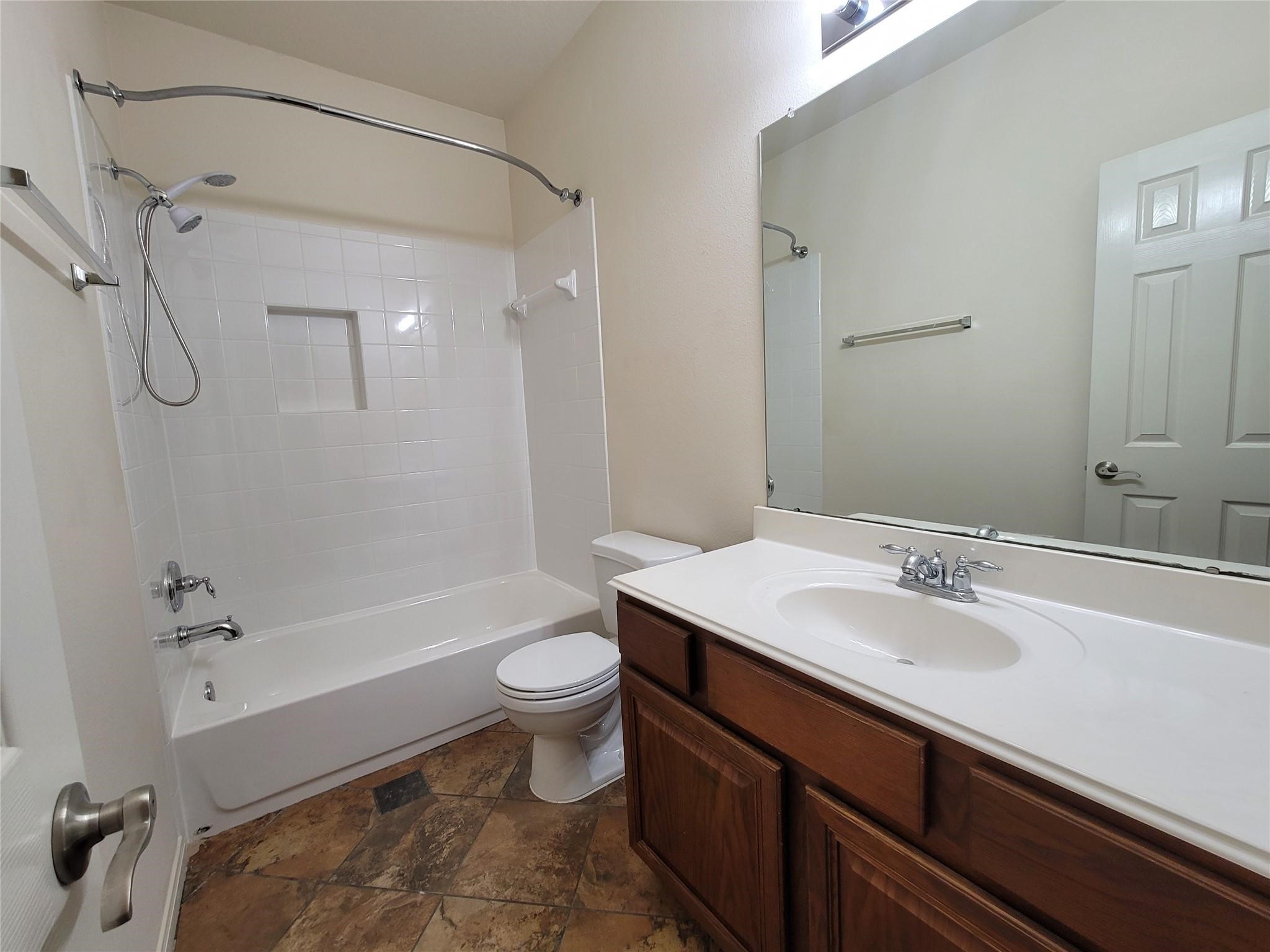438 Oak Gate Drive Conroe, TX 77304 - Photo 11 of 18 a bathroom with a sink toilet and shower