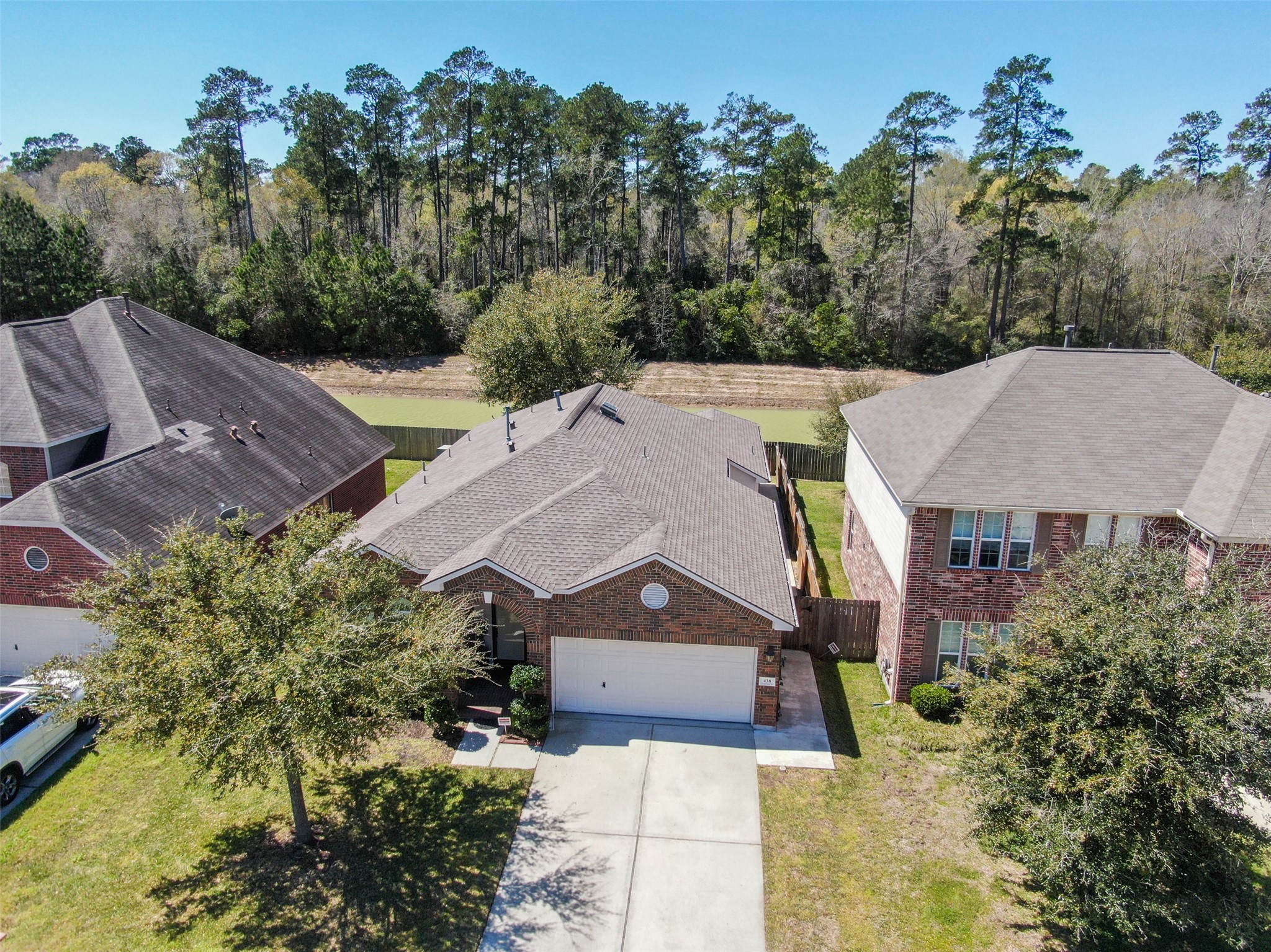 438 Oak Gate Drive Conroe, TX 77304 - Photo 13 of 18 an aerial view of a house with a big yard