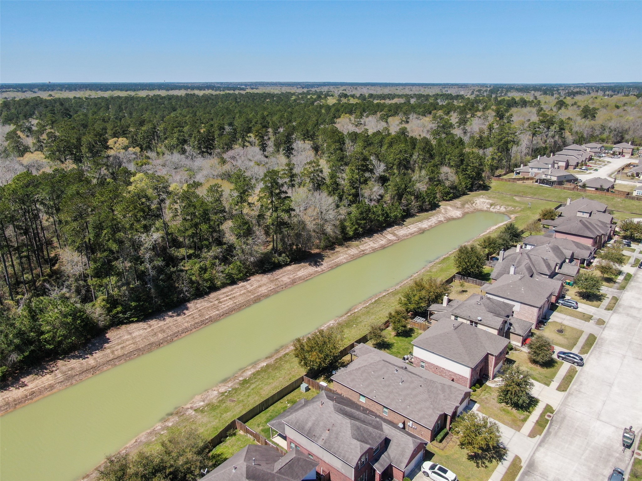 438 Oak Gate Drive Conroe, TX 77304 - Photo 15 of 18 a view of a city with an ocean