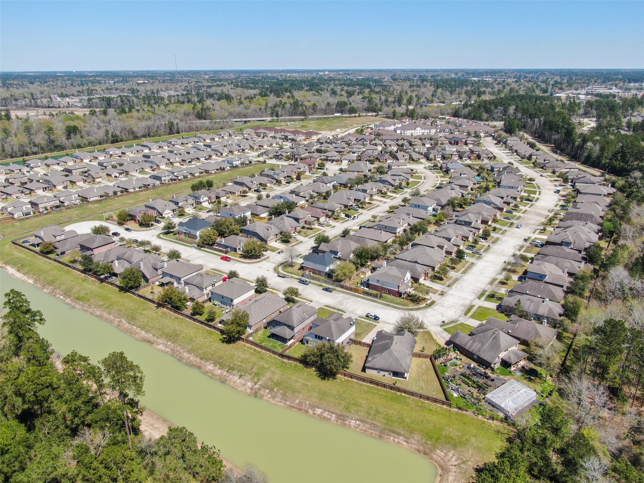438 Oak Gate Drive Conroe, TX 77304 - Photo 16 of 18 an aerial view of a city