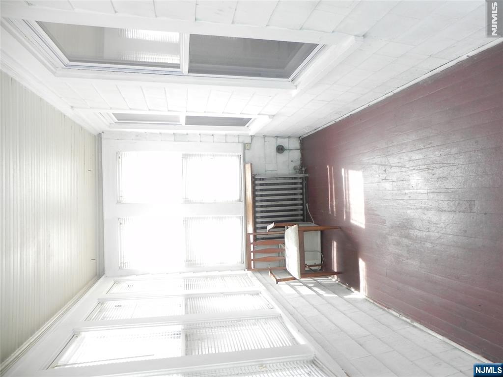 33 Center Street, Unit 1 Little Ferry, NJ 07643 - Photo 2 of 12 a view of a room with wooden floor and furniture