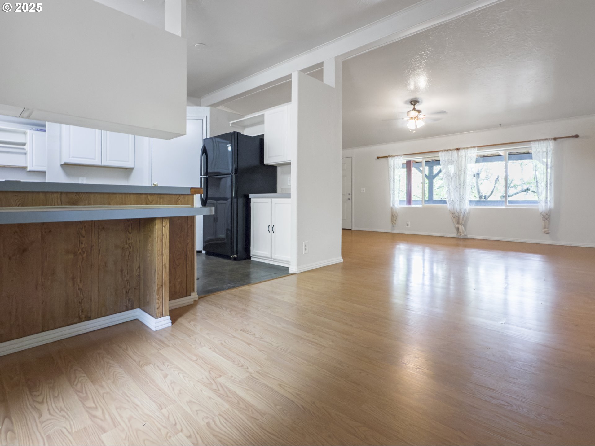 98041 Hallway Road, Unit 26 Brookings, OR 97415 - Photo 11 of 46 a kitchen with stainless steel appliances granite countertop a refrigerator and a sink