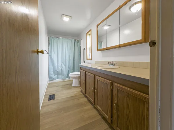 a view of a room with shelf on the wall