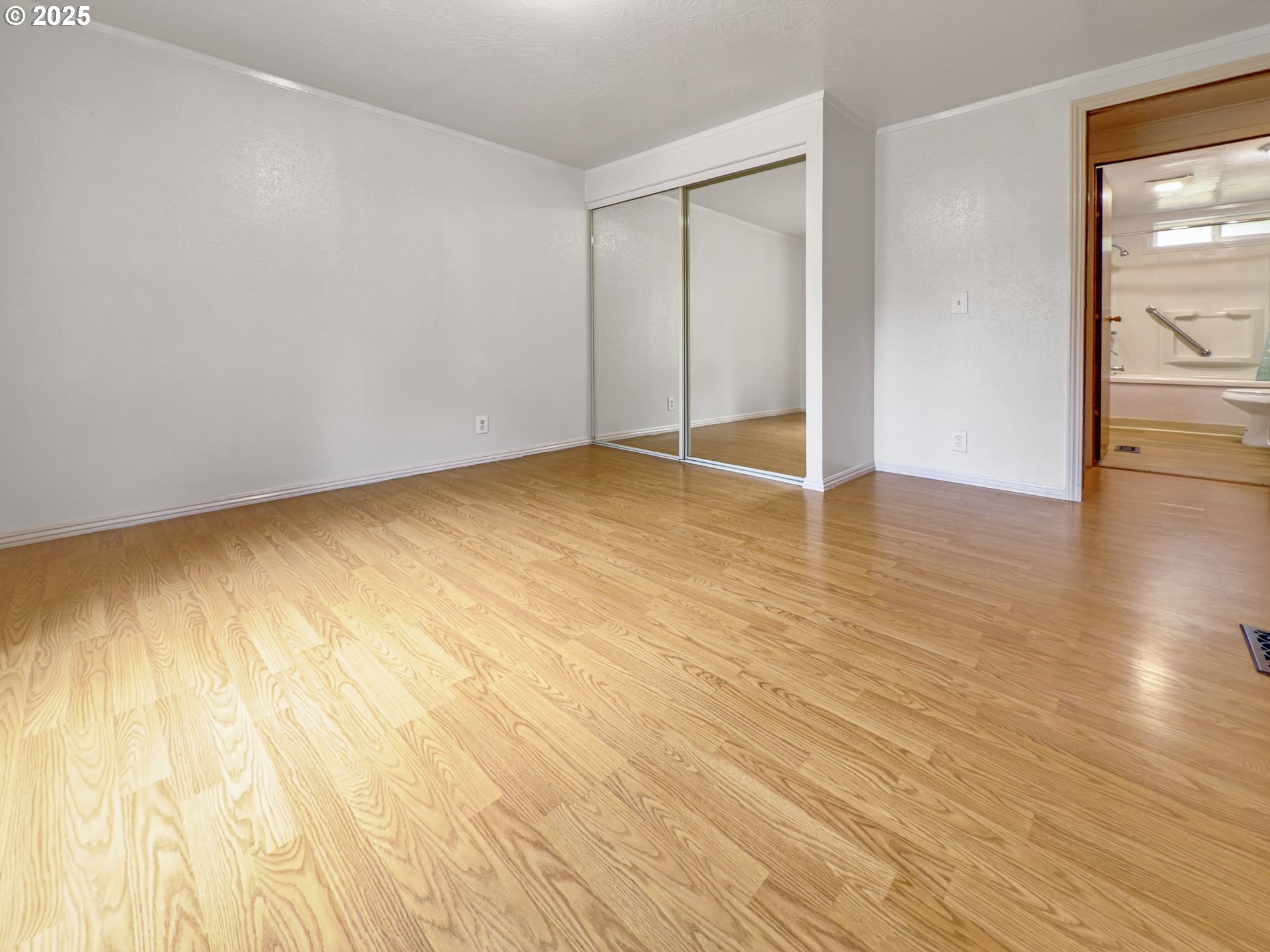 98041 Hallway Road, Unit 26 Brookings, OR 97415 - Photo 30 of 46 a view of an empty room and wooden floor