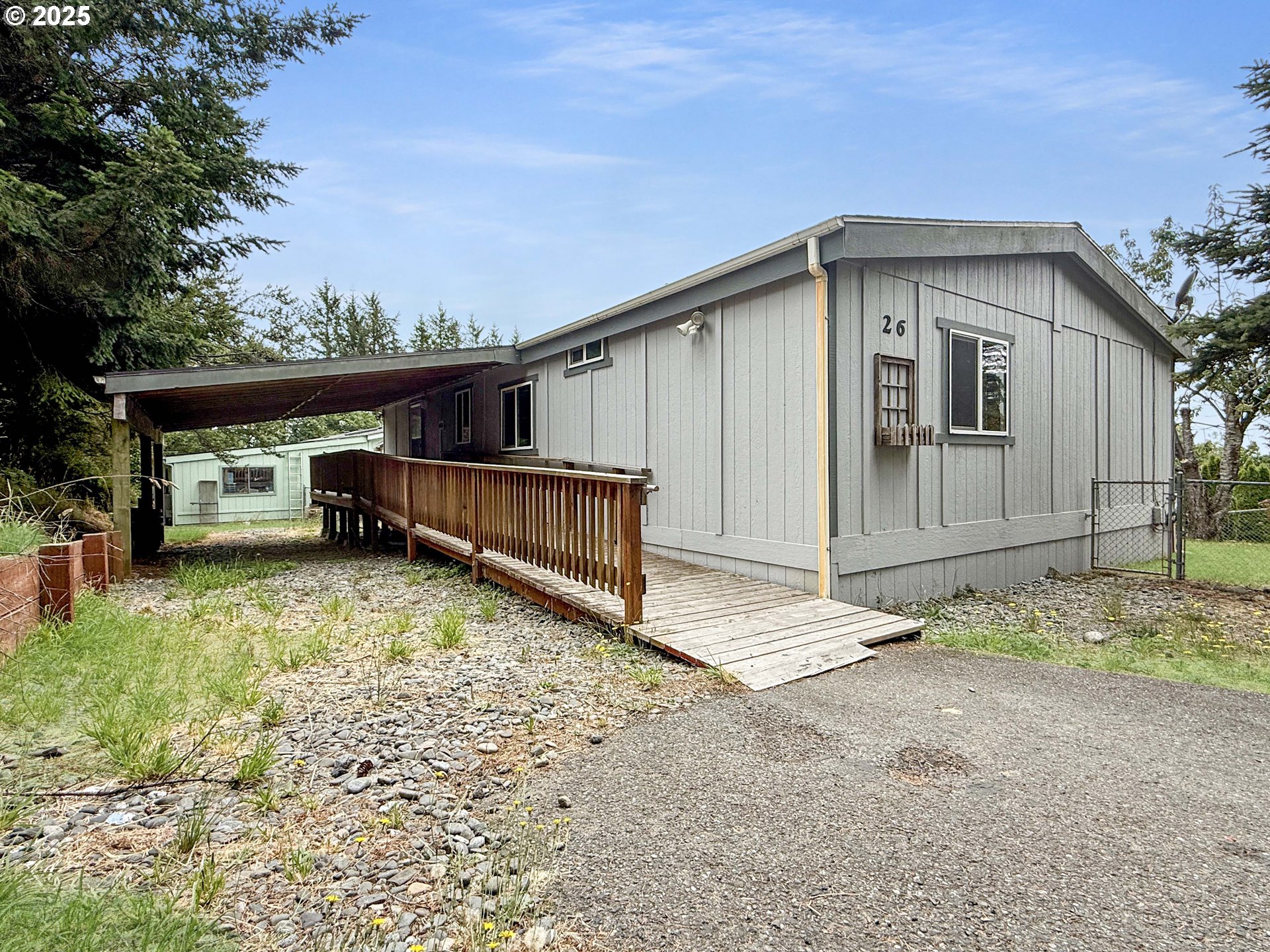 98041 Hallway Road, Unit 26 Brookings, OR 97415 - Photo 3 of 46 a view of backyard of house