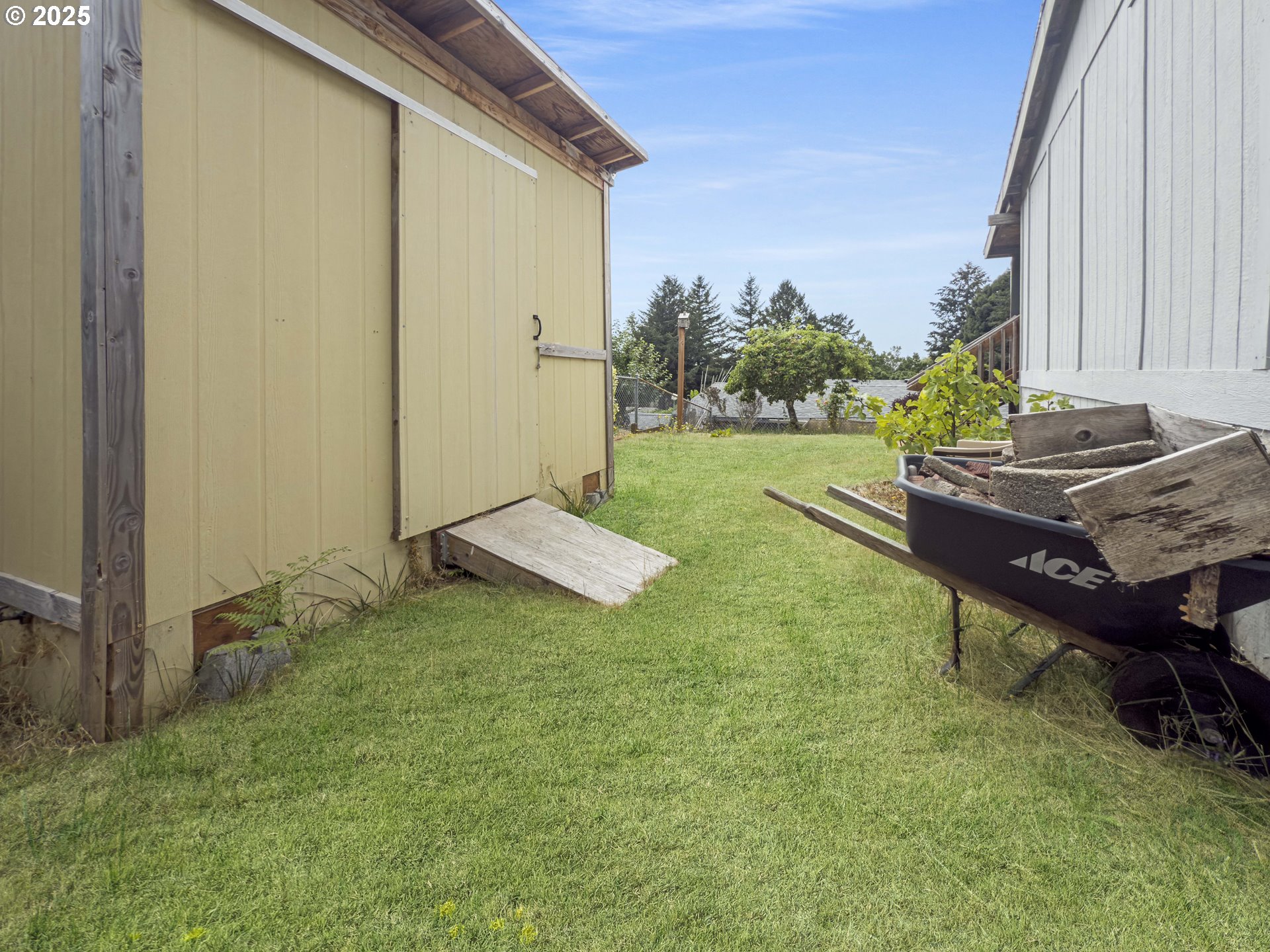 98041 Hallway Road, Unit 26 Brookings, OR 97415 - Photo 40 of 46 a view of backyard with trampoline