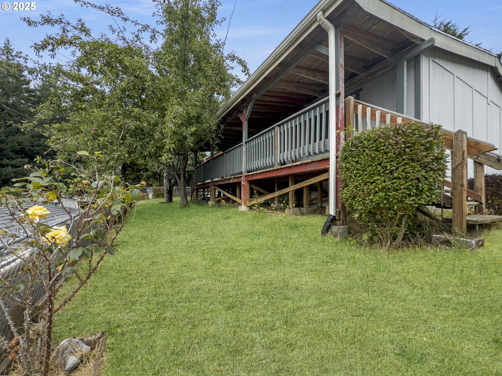 98041 Hallway Road, Unit 26 Brookings, OR 97415 - Photo 42 of 46 a house view with a garden space