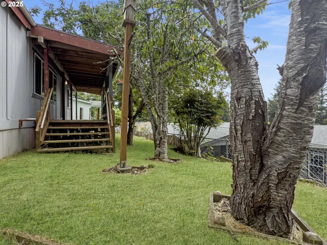 a view of balcony with wooden floor and seating space