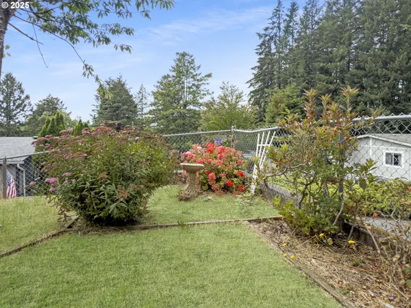 a backyard of a house with portable swimming pool and basket ball court