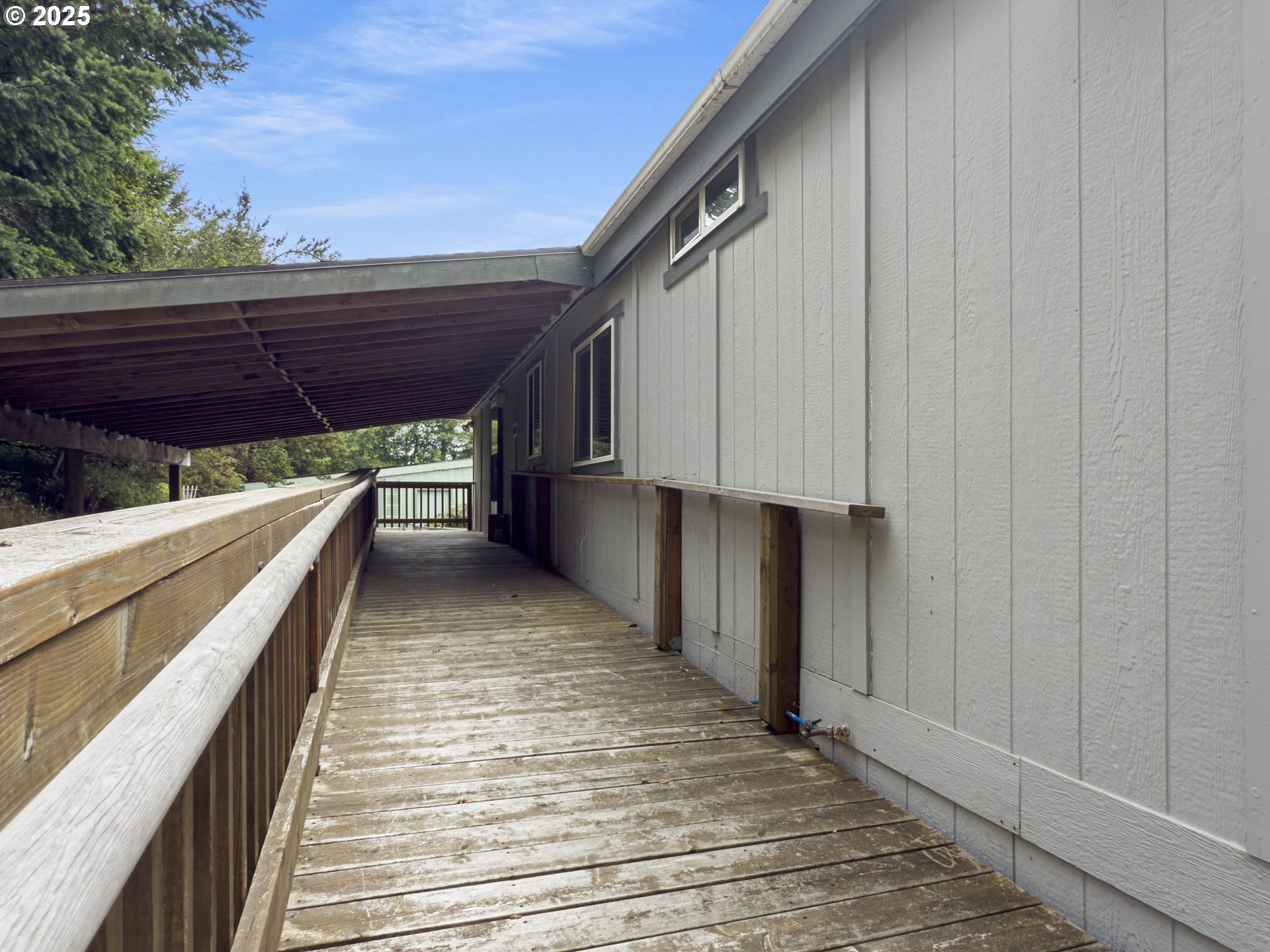 98041 Hallway Road, Unit 26 Brookings, OR 97415 - Photo 45 of 46 a view of balcony with wooden floor and seating space