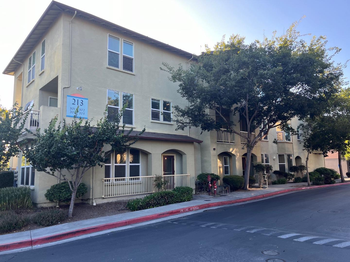 a front view of a house with a street