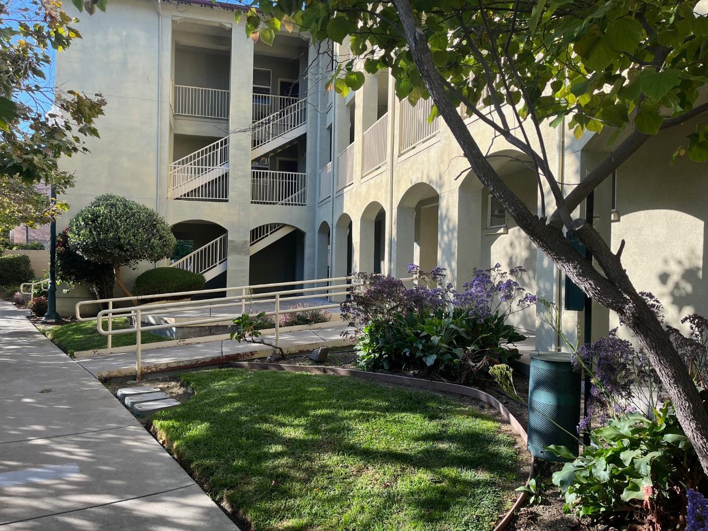 213 Pacifica Boulevard, Unit 202 Watsonville, CA 95076 - Photo 3 of 19 a front view of a house with garden