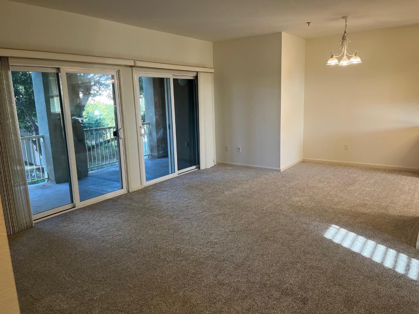 213 Pacifica Boulevard, Unit 202 Watsonville, CA 95076 - Photo 7 of 19 a view of empty room with floor to ceiling window