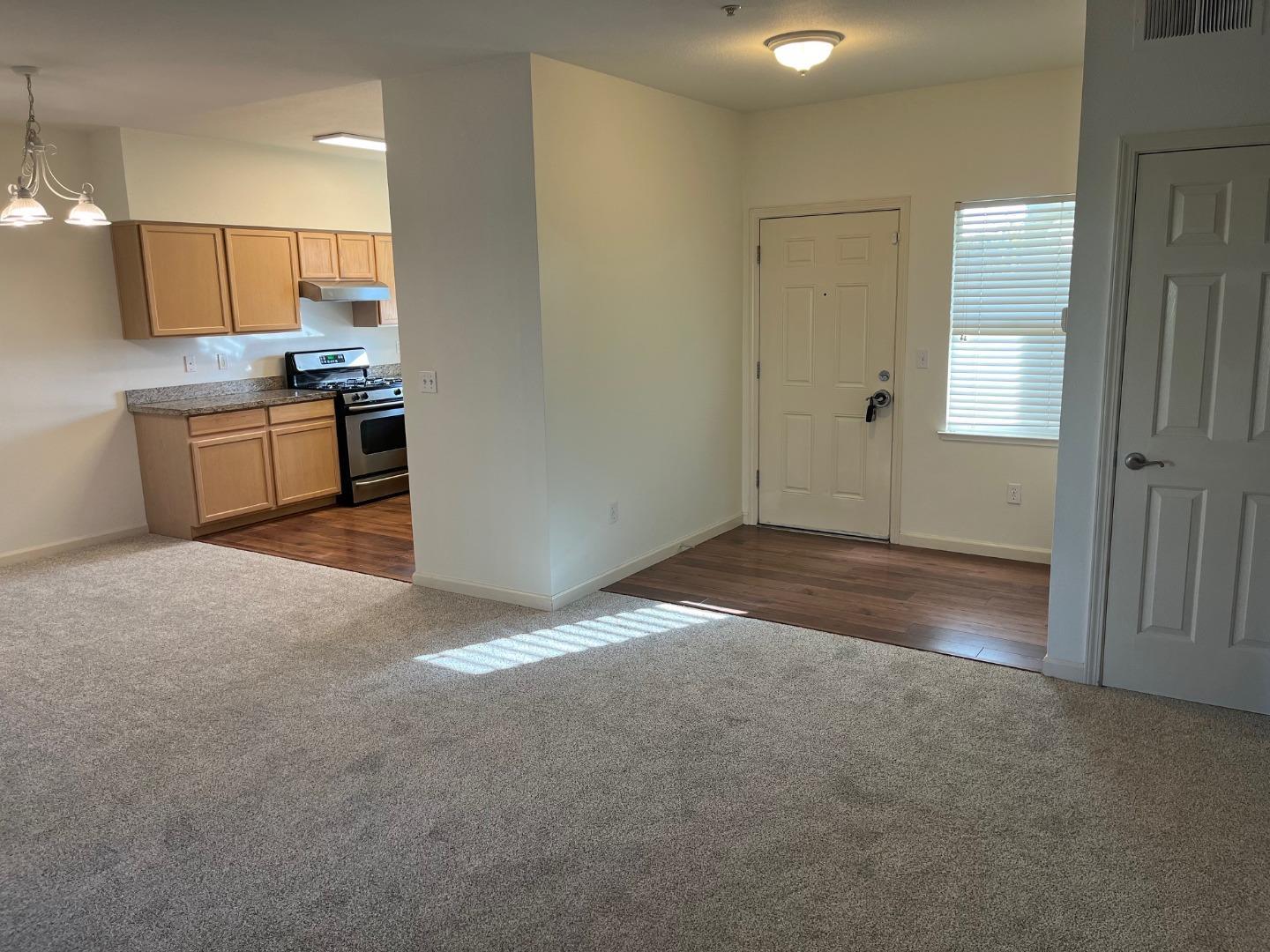 213 Pacifica Boulevard, Unit 202 Watsonville, CA 95076 - Photo 9 of 19 a view of a kitchen with a sink and dishwasher cabinets
