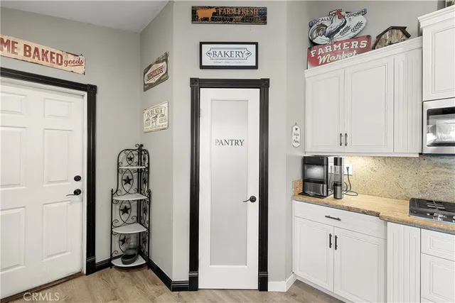 a bedroom with a bed and a night stand