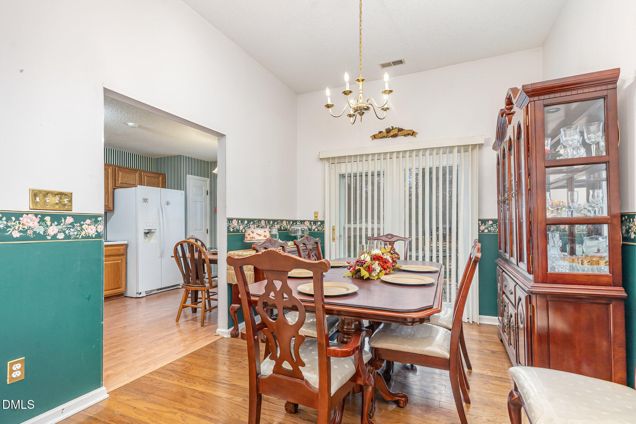 1009 Willow Ridge Drive Knightdale, NC 27545 - Photo 11 of 28 a view of a dining room with furniture window and wooden floor