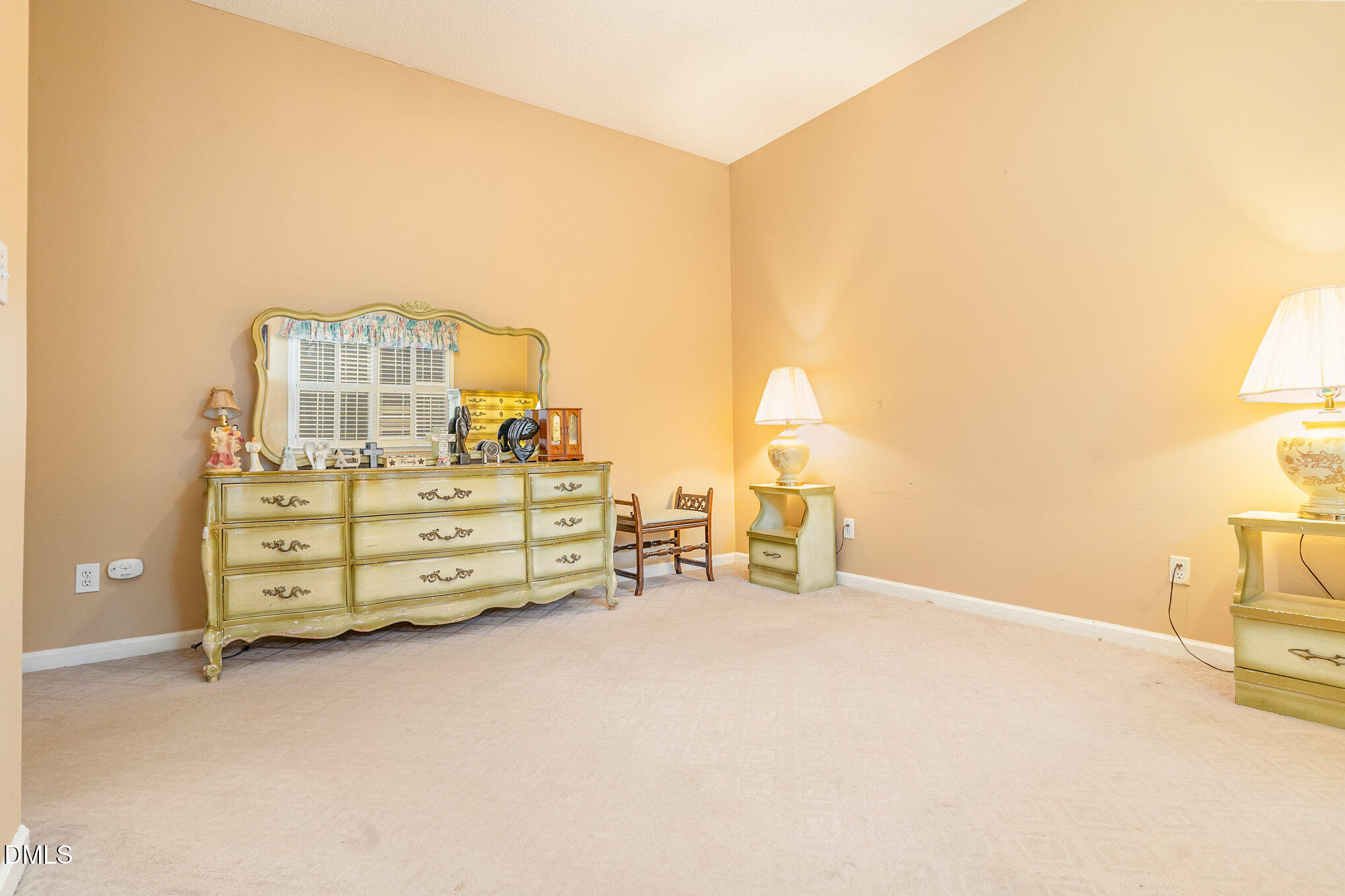 1009 Willow Ridge Drive Knightdale, NC 27545 - Photo 17 of 28 a view of a bedroom with cabinet and mirror