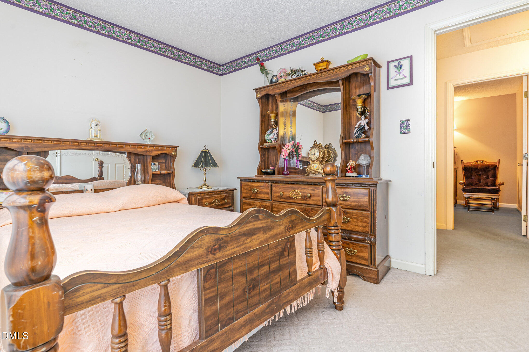 1009 Willow Ridge Drive Knightdale, NC 27545 - Photo 22 of 28 a bedroom with furniture and a mirror