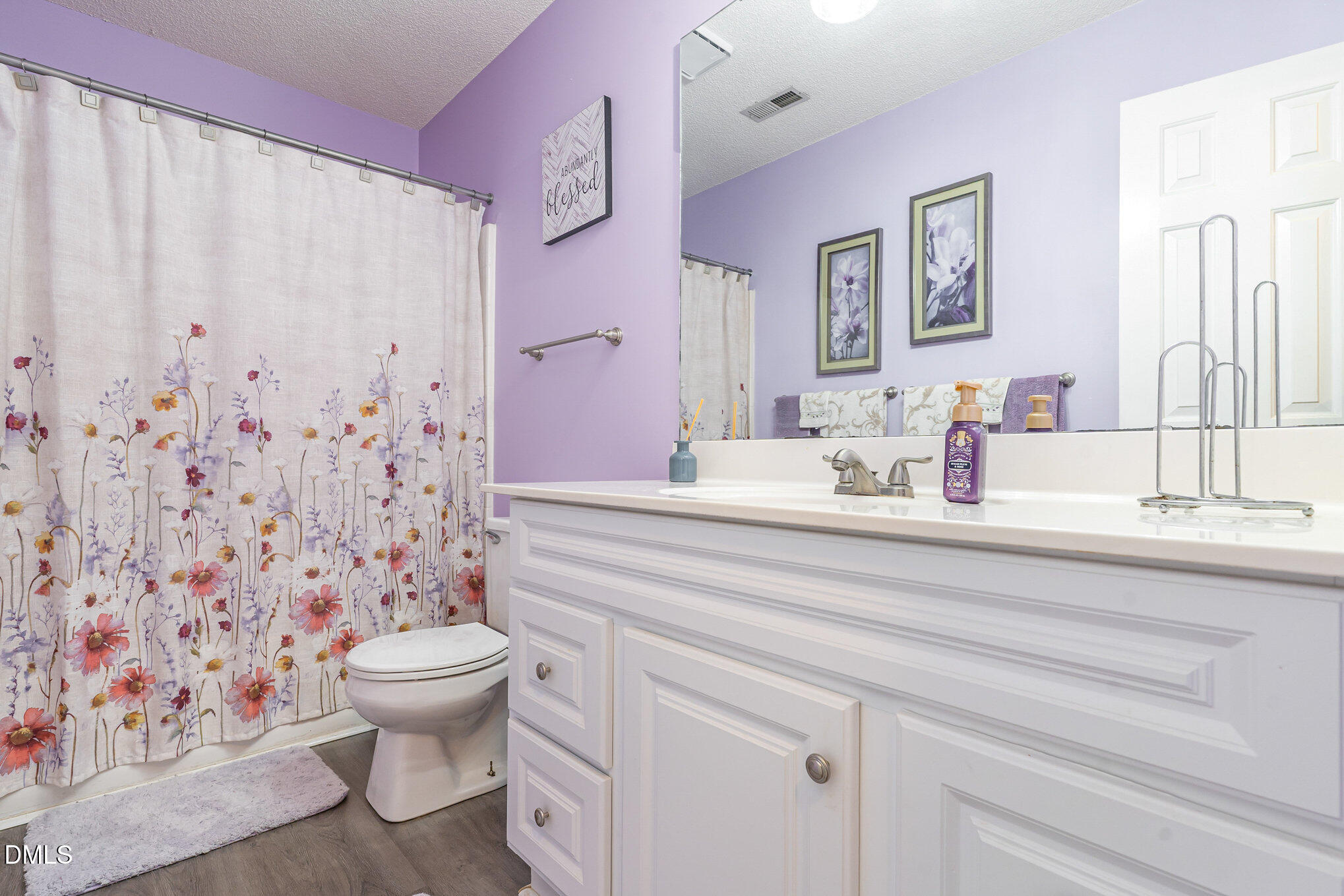1009 Willow Ridge Drive Knightdale, NC 27545 - Photo 24 of 28 a bathroom with a toilet sink and mirror