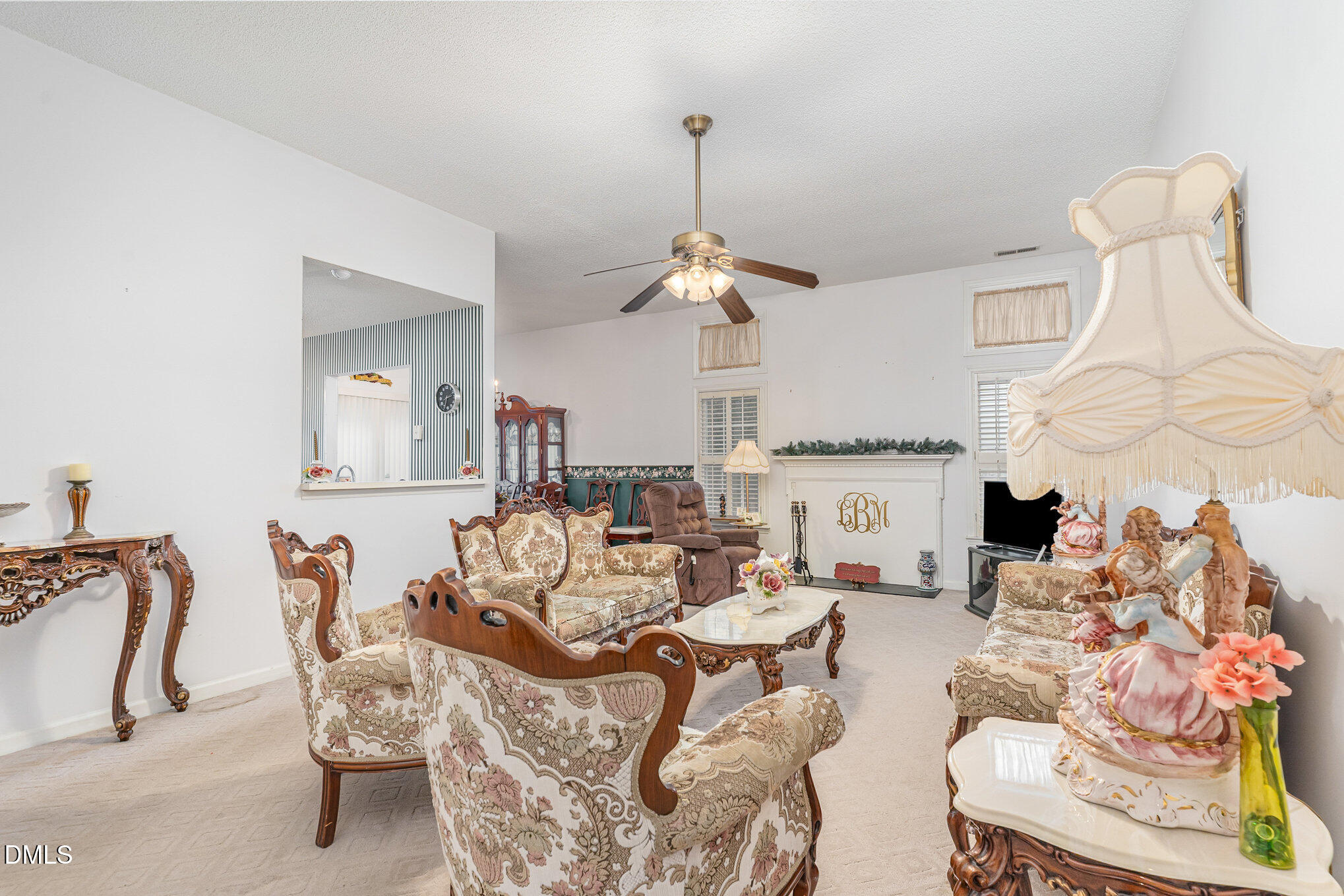 1009 Willow Ridge Drive Knightdale, NC 27545 - Photo 8 of 28 a living room with furniture a rug and white walls
