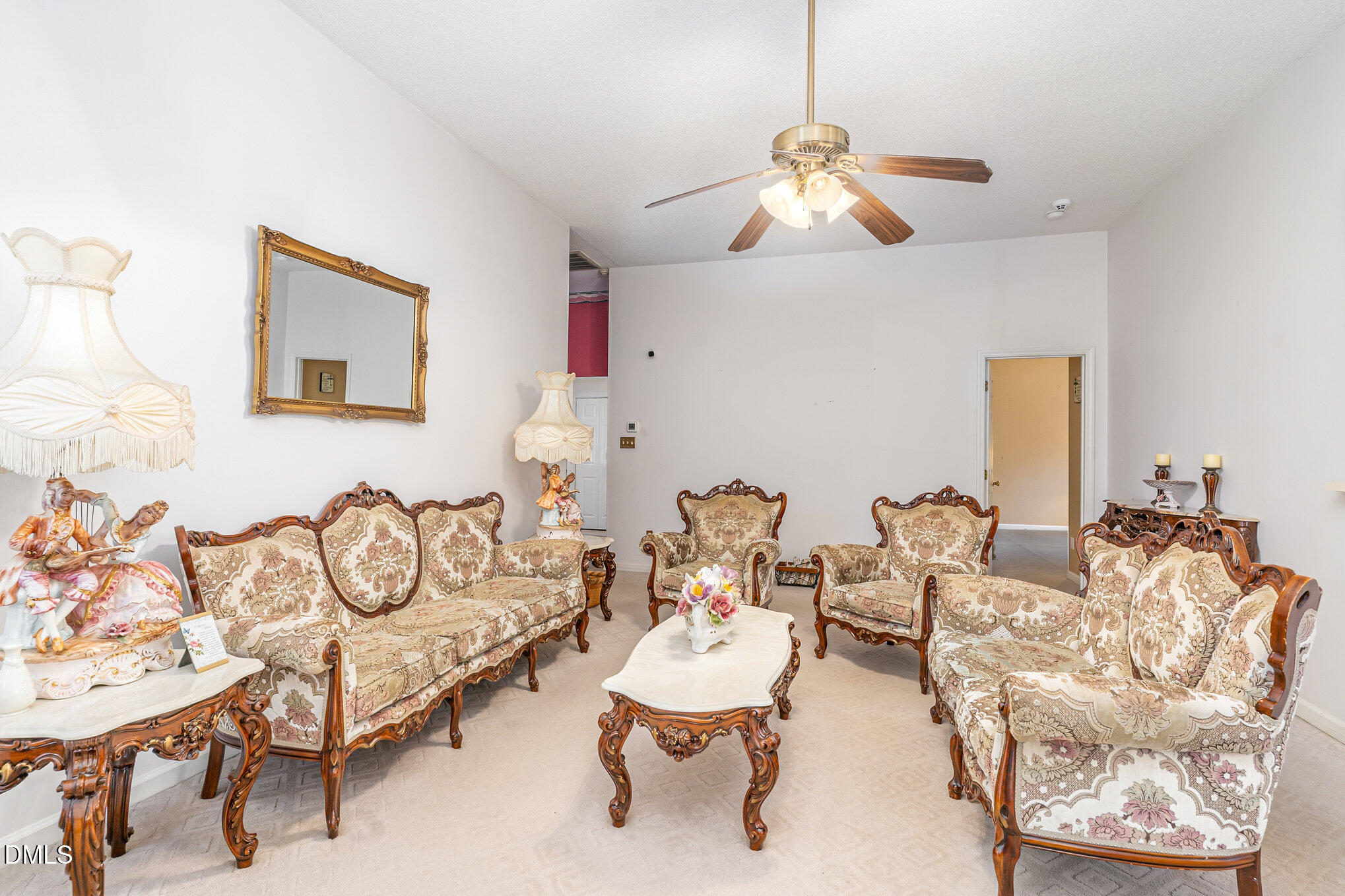 1009 Willow Ridge Drive Knightdale, NC 27545 - Photo 9 of 28 a living room with furniture and a chandelier