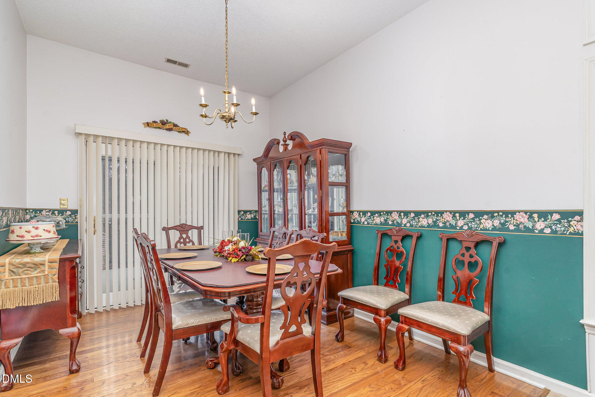 1009 Willow Ridge Drive Knightdale, NC 27545 - Photo 10 of 28 a dining room with furniture and wooden floor