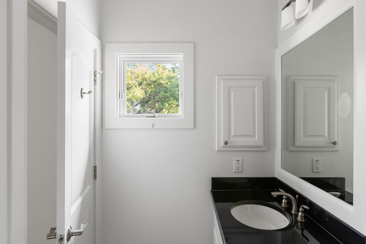 2308 West 9th Street, Unit B Austin, TX 78703 - Photo 34 of 40 a bathroom with a sink and a toilet