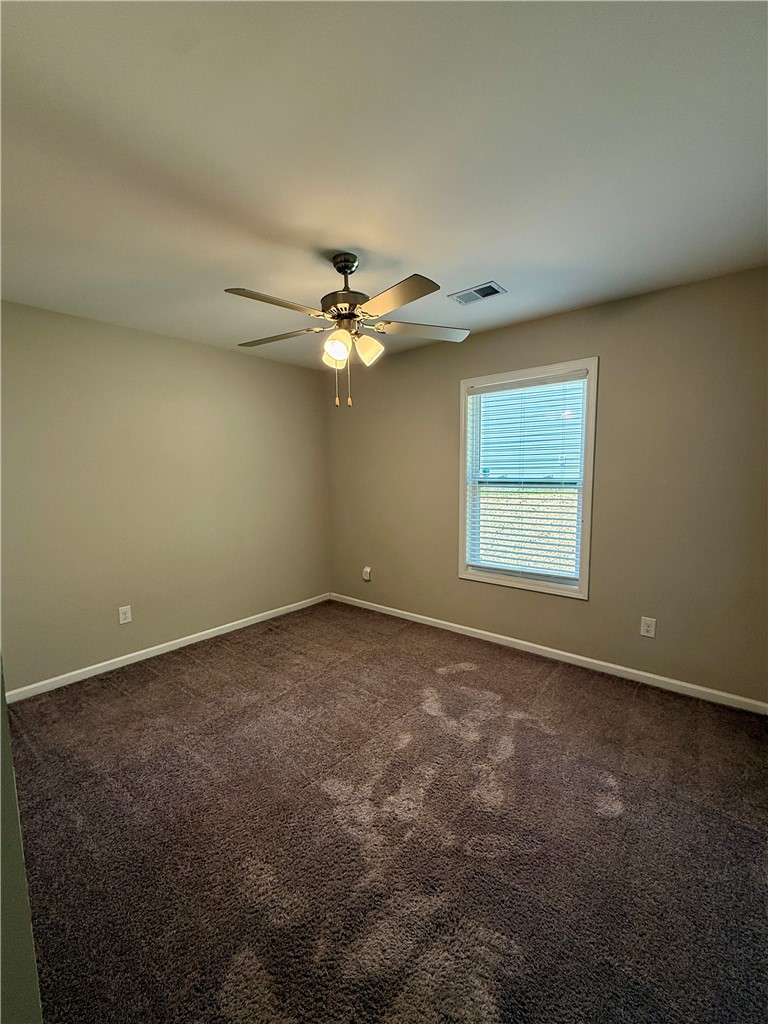 417 Laurel Grove Court Seneca, SC 29678 - Photo 5 of 10 A comfortable bedroom featuring soft carpet and a window for natural illumination.