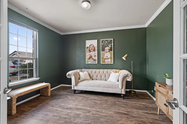 a living room with furniture and a window