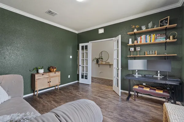 a bedroom with furniture and a book shelf