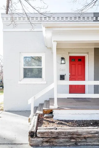 a living room with kitchen