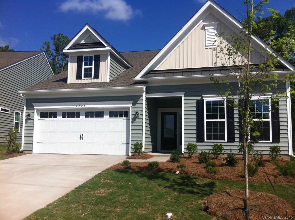 4225 Perth Road, Unit 344 Indian Land, SC 29707 - Photo 1 of 14 a front view of a house with a yard and garage