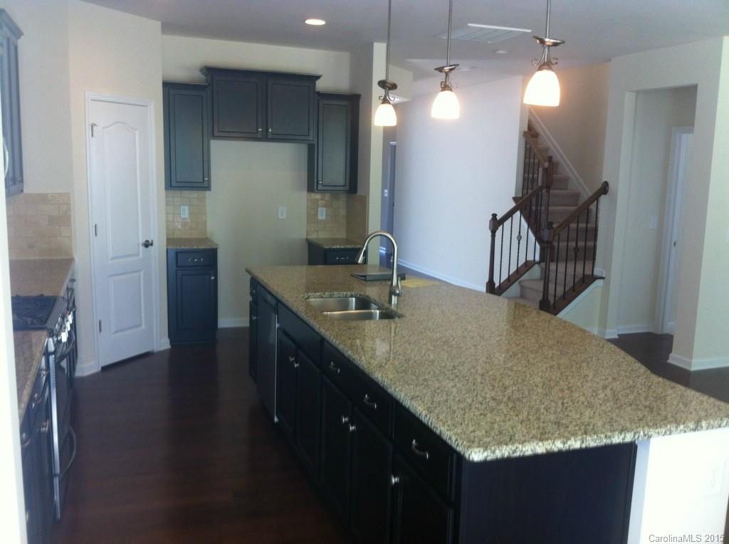 4225 Perth Road, Unit 344 Indian Land, SC 29707 - Photo 4 of 14 a bathroom with a granite countertop sink and a mirror