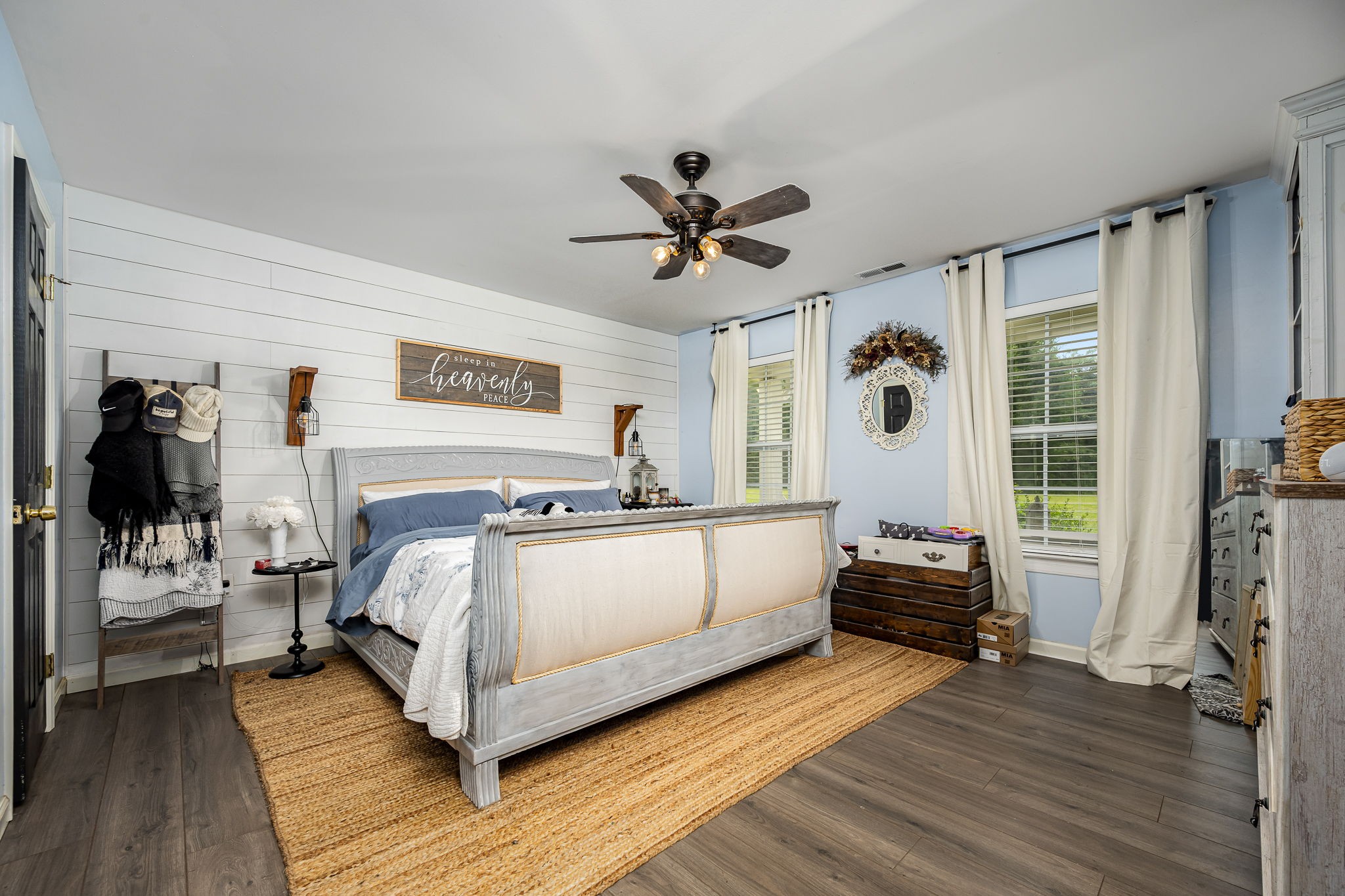 4842 Lunns Store Road Chapel Hill, TN 37034 - Photo 18 of 52 a white bed sitting in a bedroom next to a window with a flat screen tv