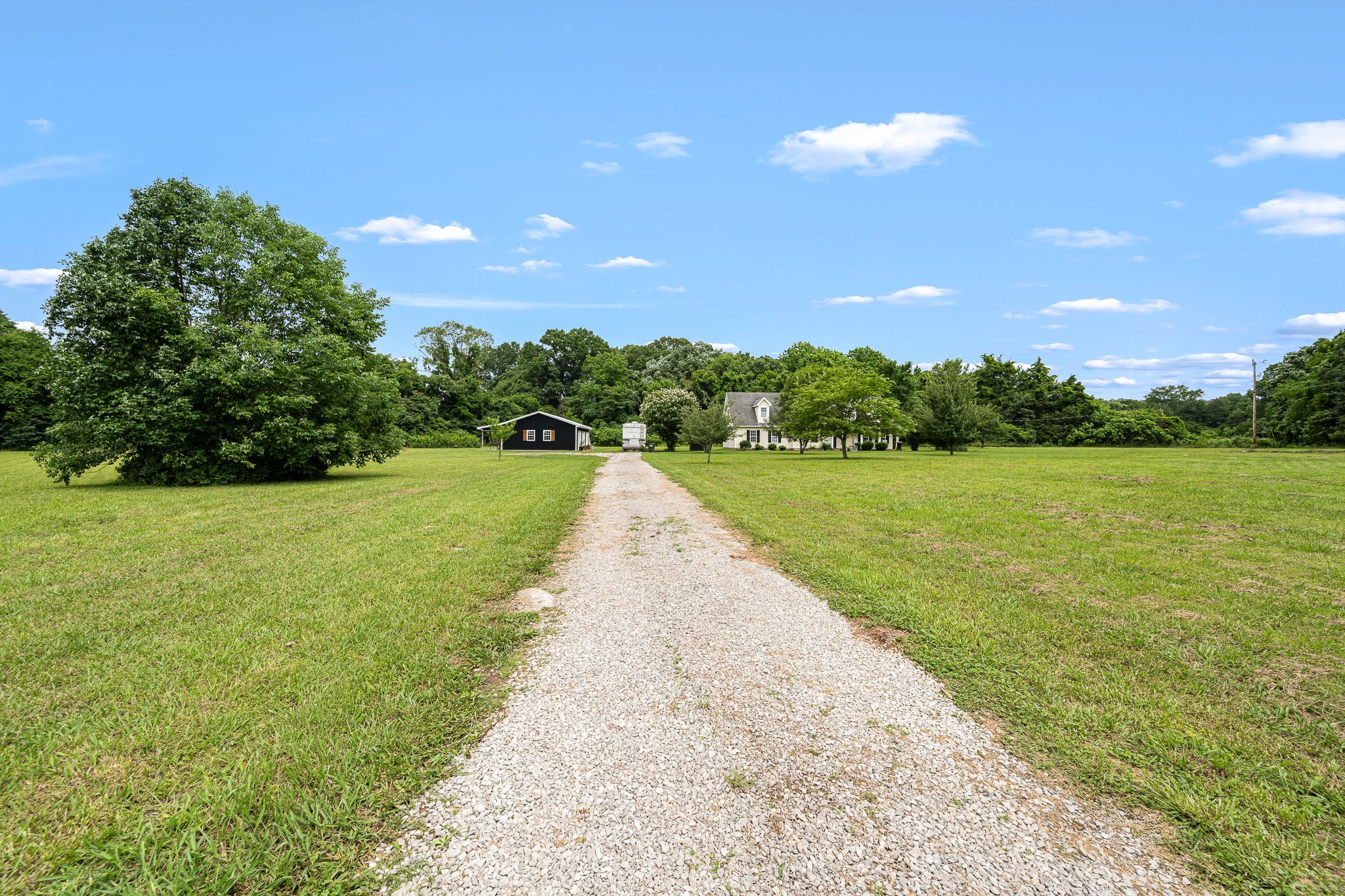 4842 Lunns Store Road Chapel Hill, TN 37034 - Photo 2 of 52 a view of a garden with a building in the background