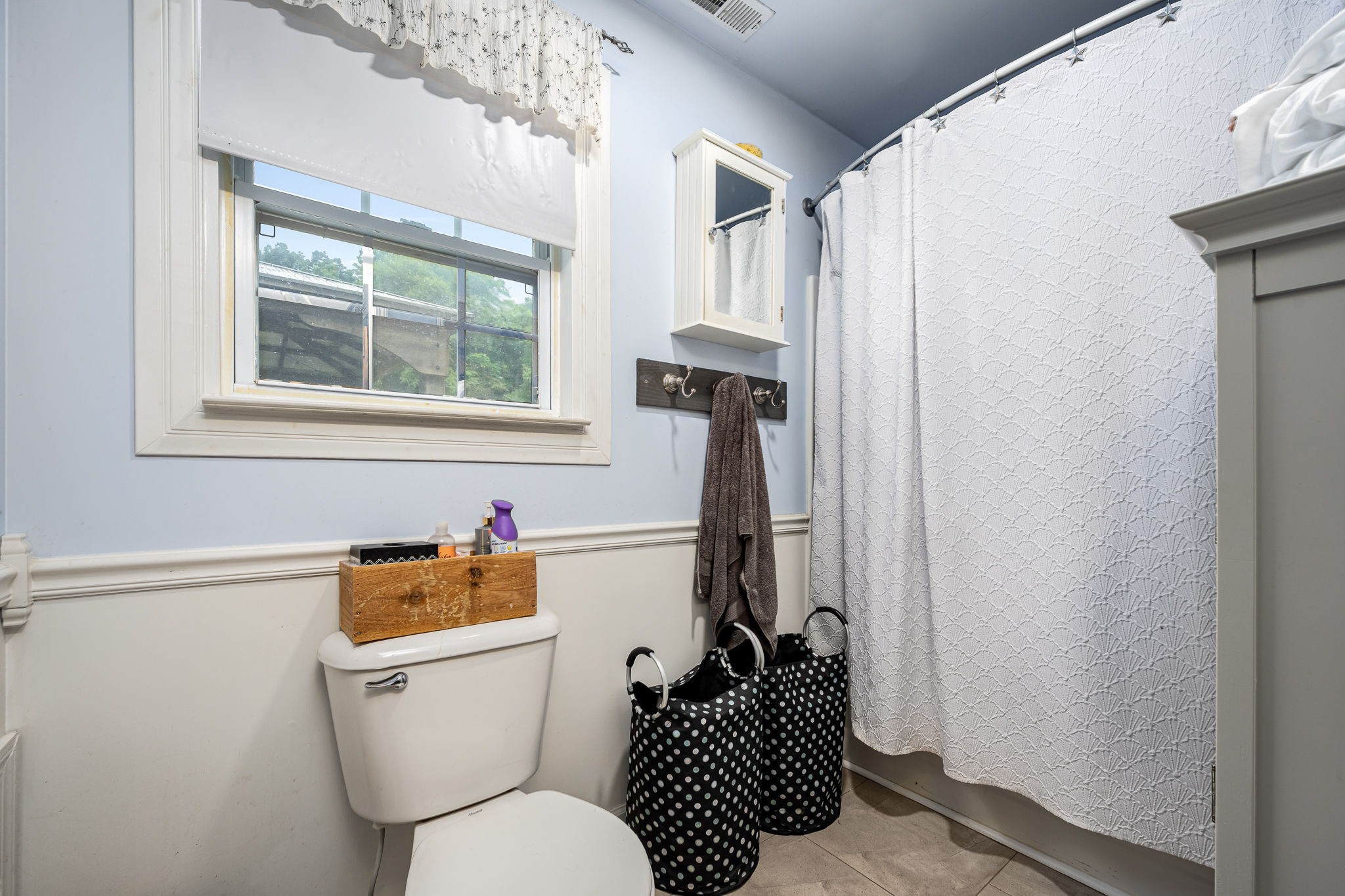 4842 Lunns Store Road Chapel Hill, TN 37034 - Photo 21 of 52 a bathroom with a toilet a sink and a window