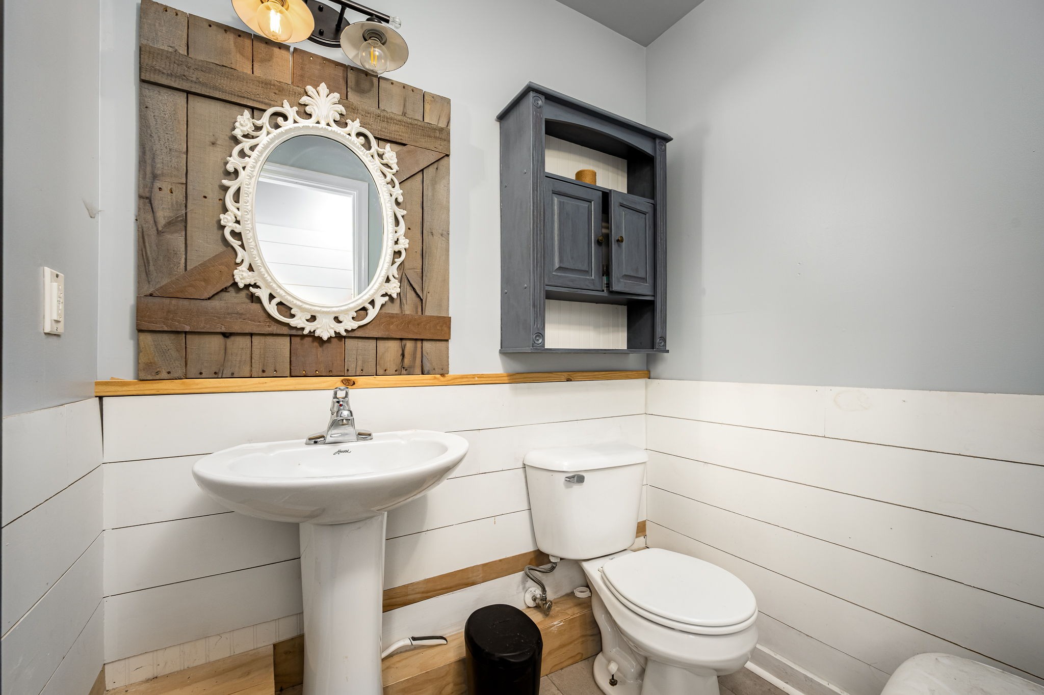 4842 Lunns Store Road Chapel Hill, TN 37034 - Photo 24 of 52 a bathroom with a toilet a sink and mirror