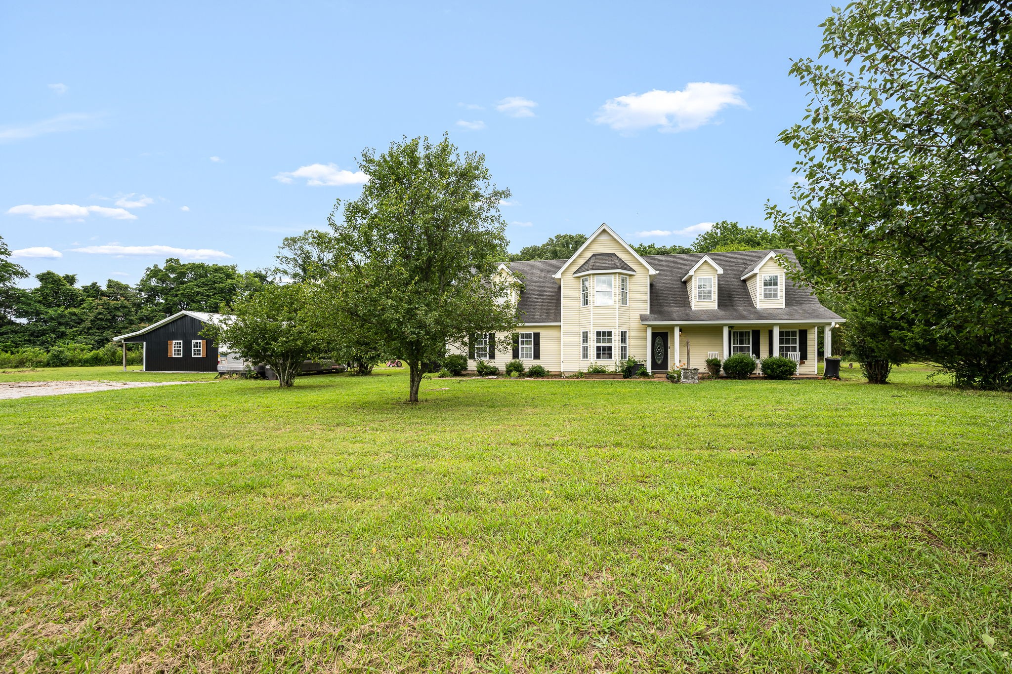 4842 Lunns Store Road Chapel Hill, TN 37034 - Photo 6 of 52 a front view of a house with a garden