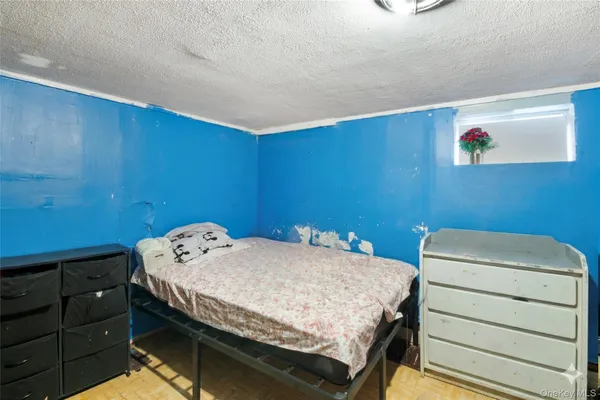 a bedroom with a bed and a cabinets