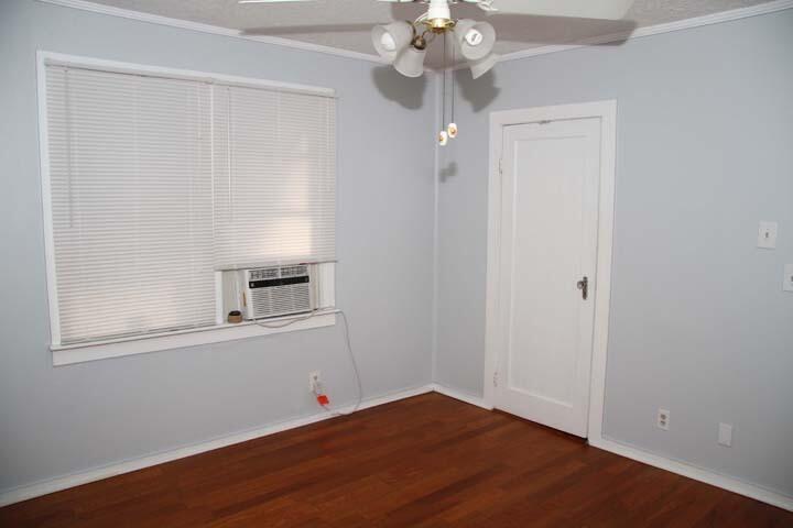 3738 Eagle Avenue Key West, FL 33040 - Photo 34 of 37 an empty room with a window and chandelier fan
