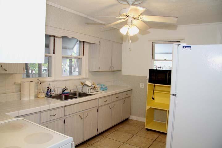 3738 Eagle Avenue Key West, FL 33040 - Photo 10 of 37 a kitchen with a sink cabinets and window